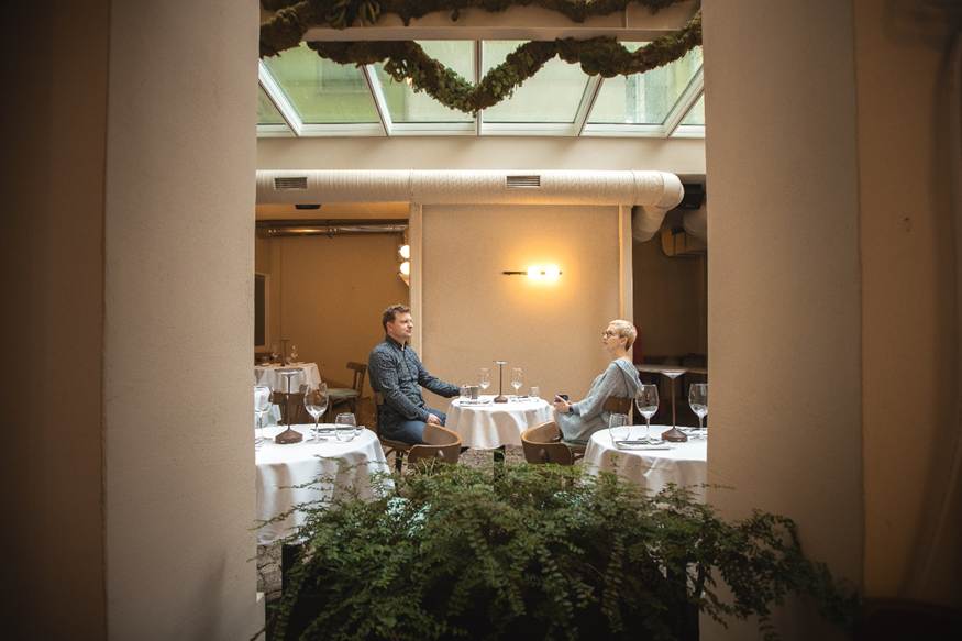 A person and person sitting at tables in a restaurant

AI-generated content may be incorrect.